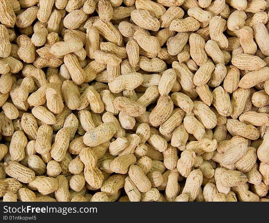 Close up on a pile of peanuts ready for sale.