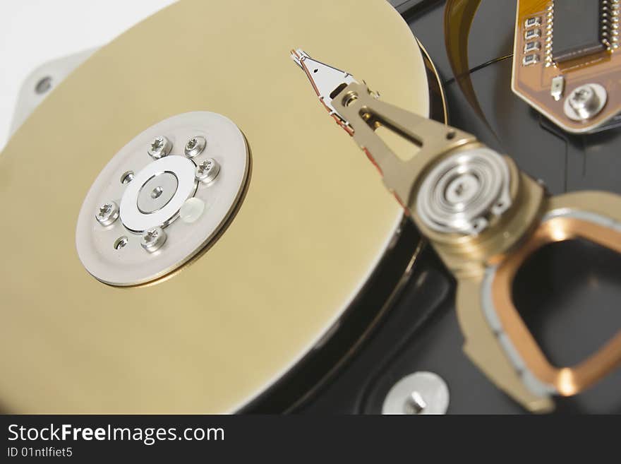 Closeup of the platters and read/write head of a computer hard drive. Closeup of the platters and read/write head of a computer hard drive