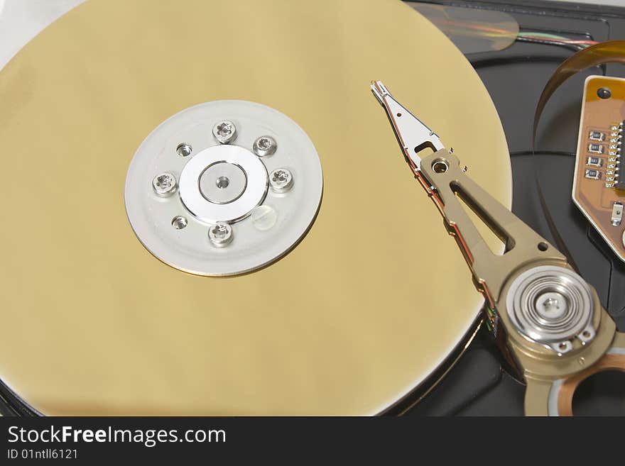 Closeup of the platters and read/write head of a computer hard drive. Closeup of the platters and read/write head of a computer hard drive