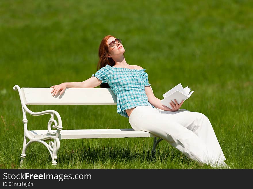 Summer - Young woman on white bench