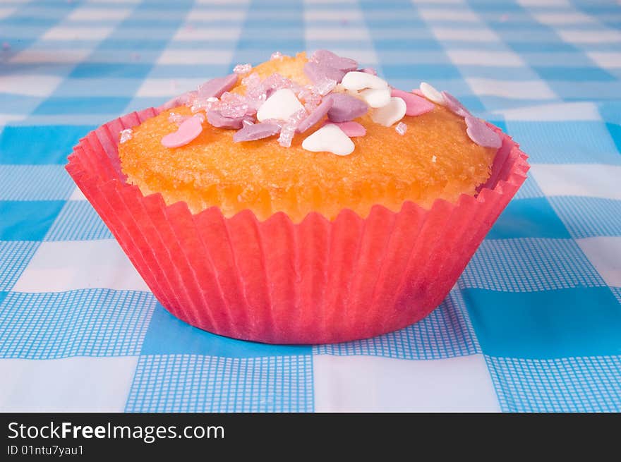 Delicious tasty cupcake with hearts decoration