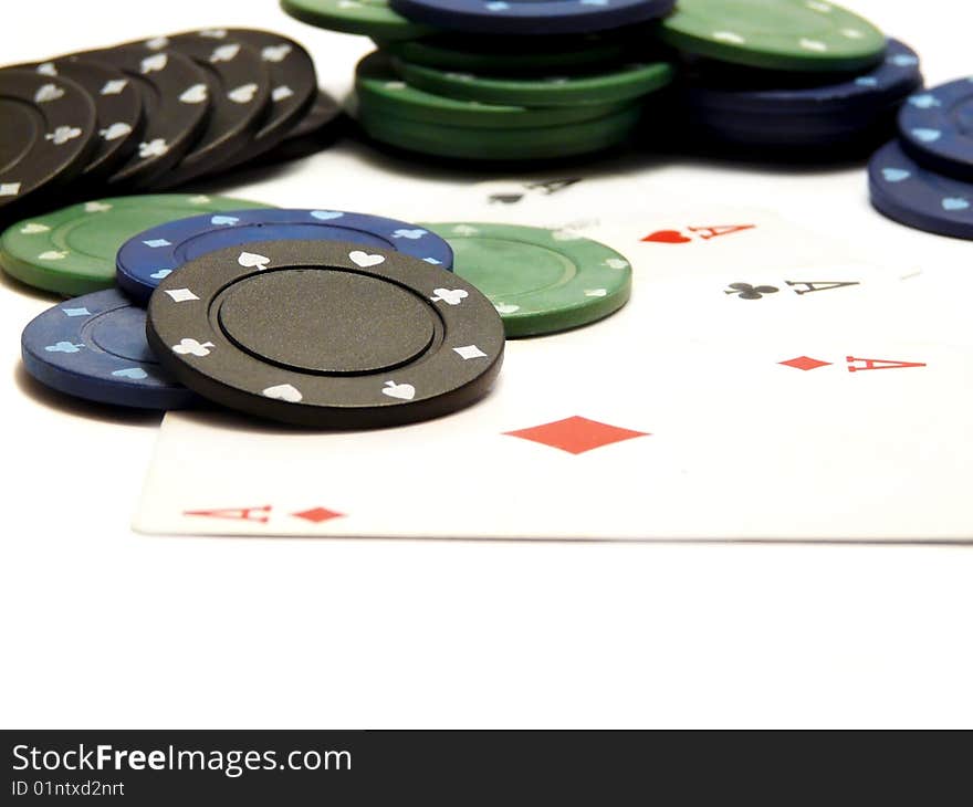 Four aces and casino chips isolated over white