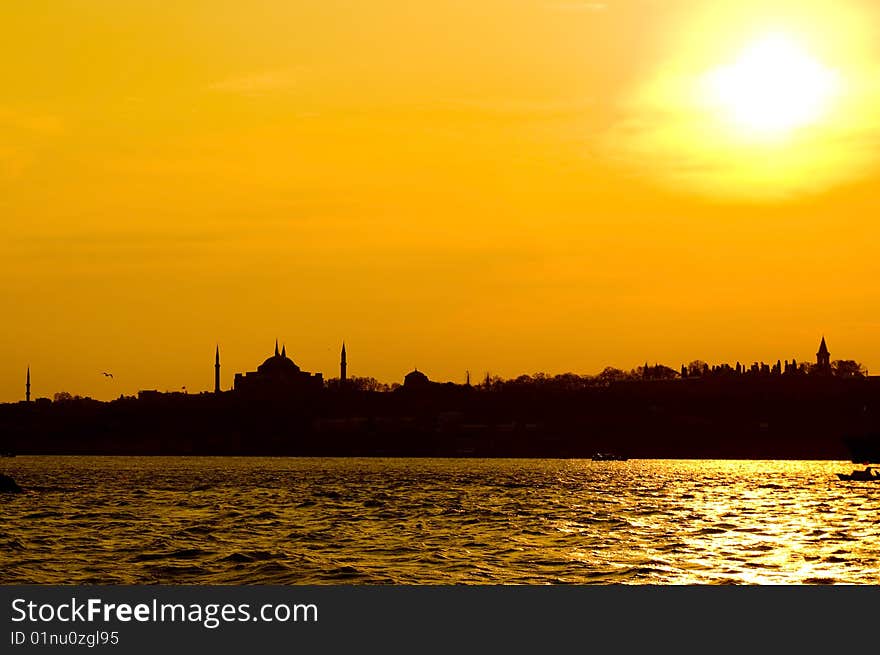 The view of Blue mosque and Hagia Sofia after sunset from Uskudar