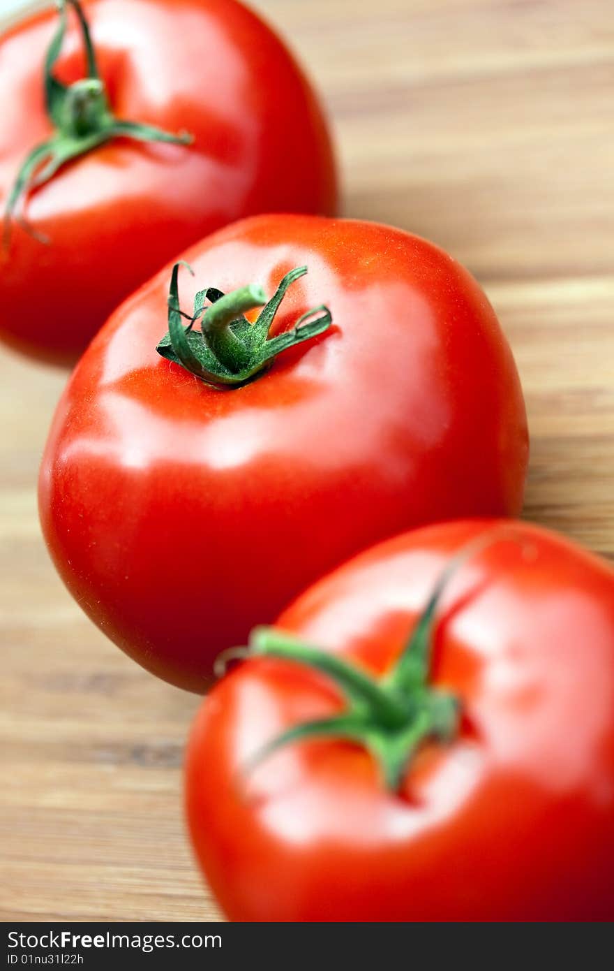 Ripe Beef Tomatoes On The Wooden Background