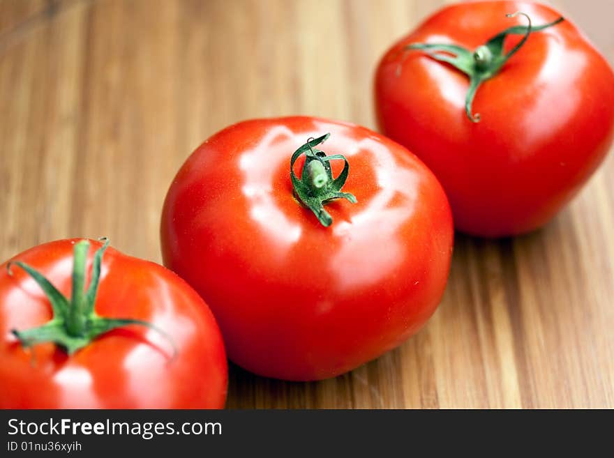 Ripe Beef Tomatoes On The Wooden Background