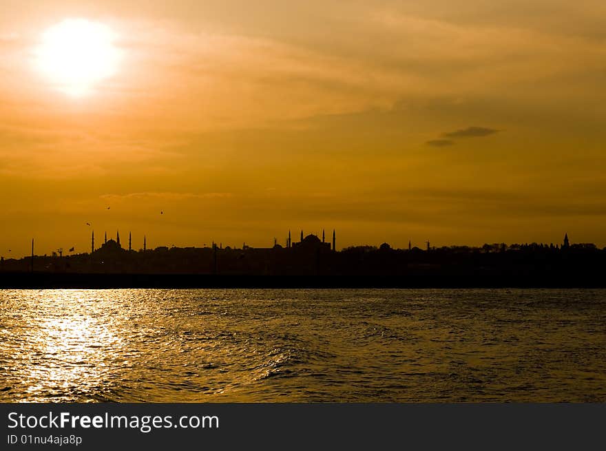 The view of Blue mosque and Hagia Sofia after sunset from Uskudar