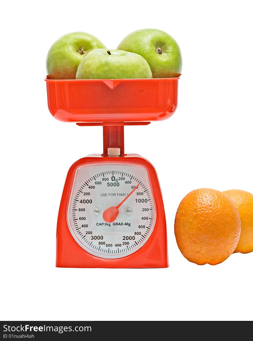 Red kitchen scale weighting apples