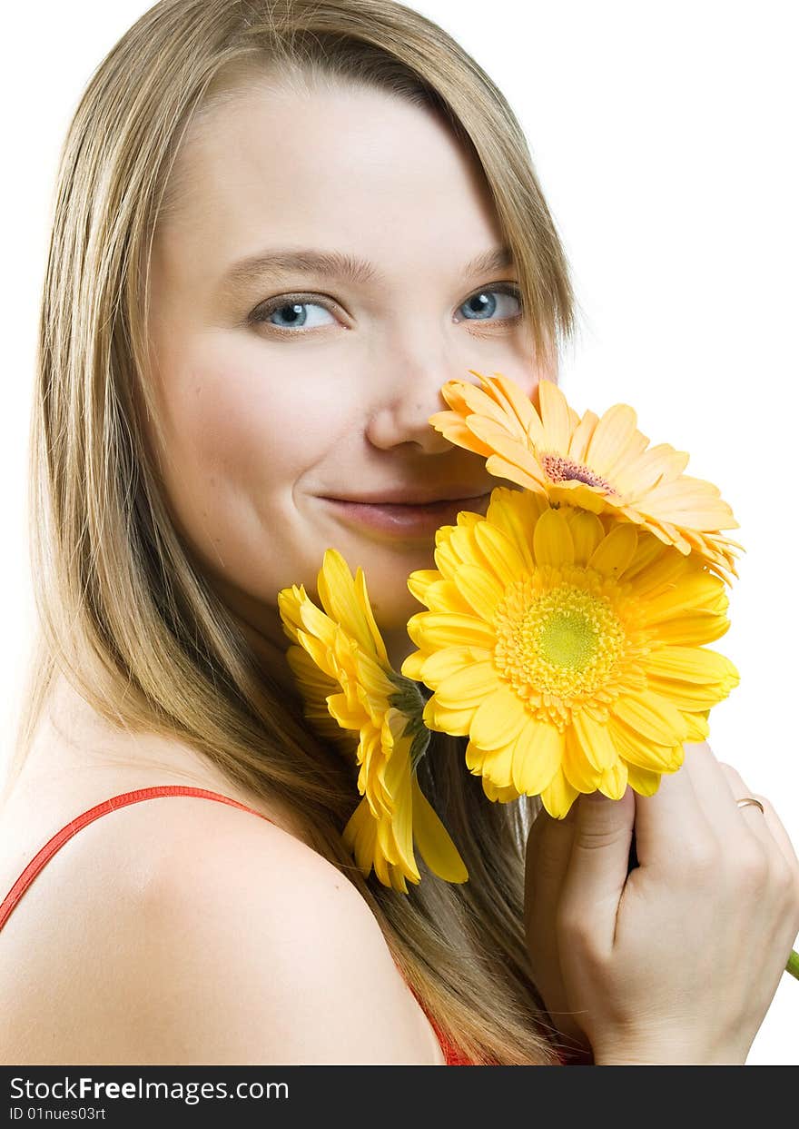 Smiling girl with yellow flowers on white background. Smiling girl with yellow flowers on white background