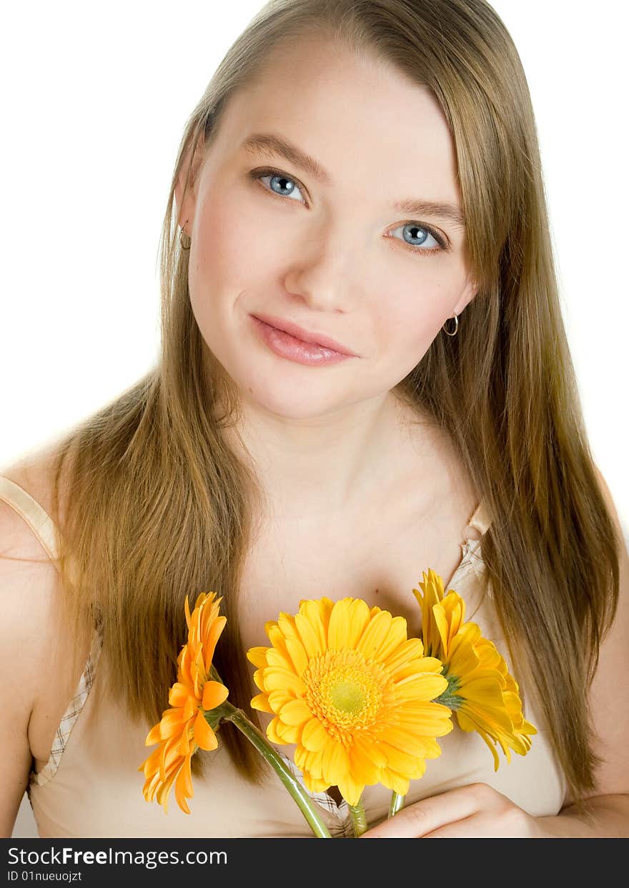 Smiling girl with yellow flowers on white background. Smiling girl with yellow flowers on white background