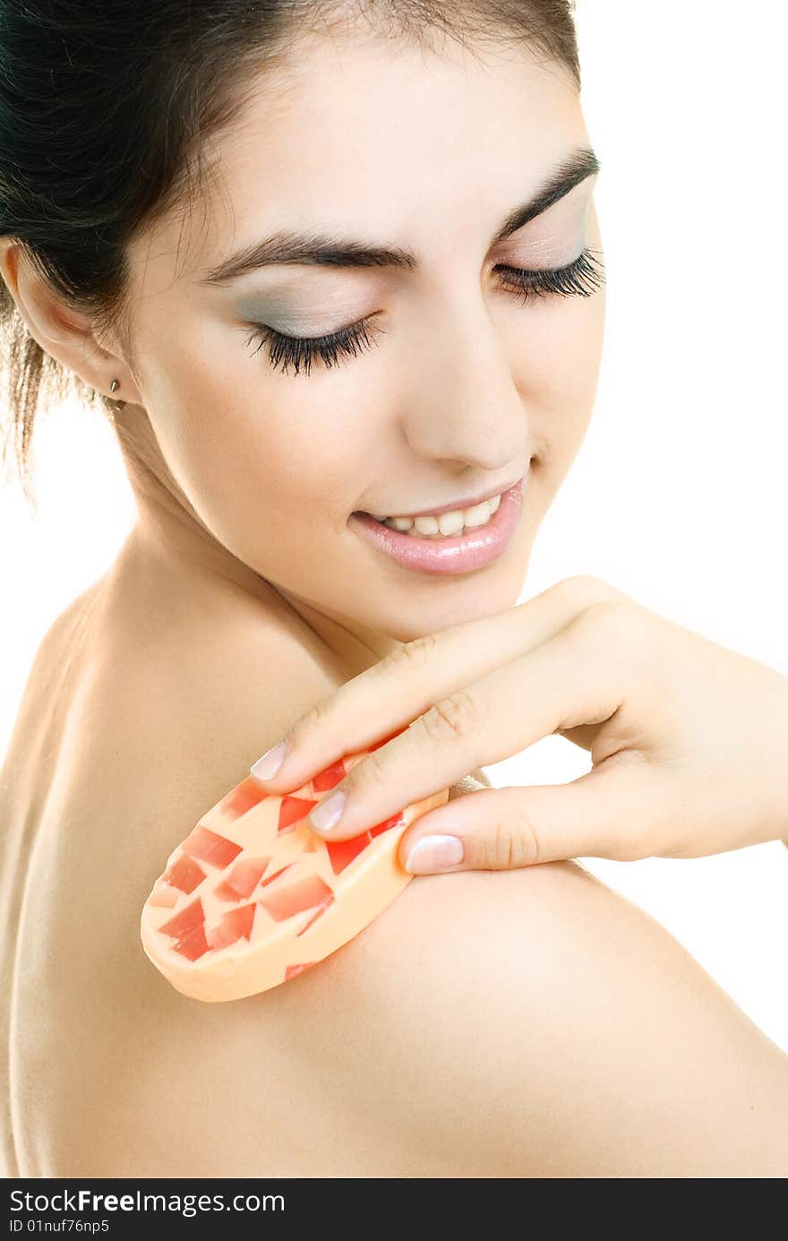 Woman washing her body with soap