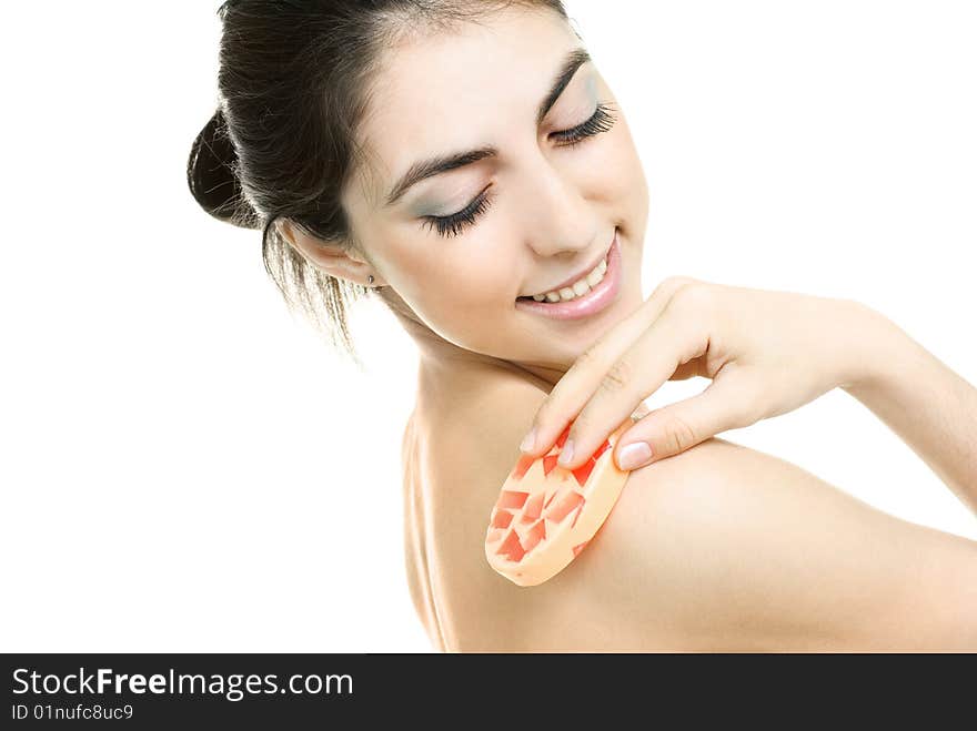 Woman washing her body with soap