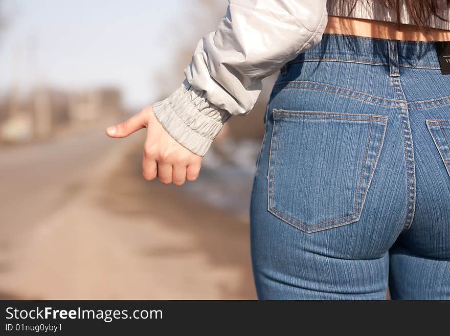 Girl hitchhiking on the street