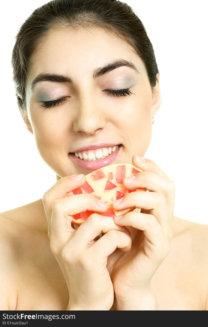 Pretty young brunette woman holding a soap in her hands. Pretty young brunette woman holding a soap in her hands