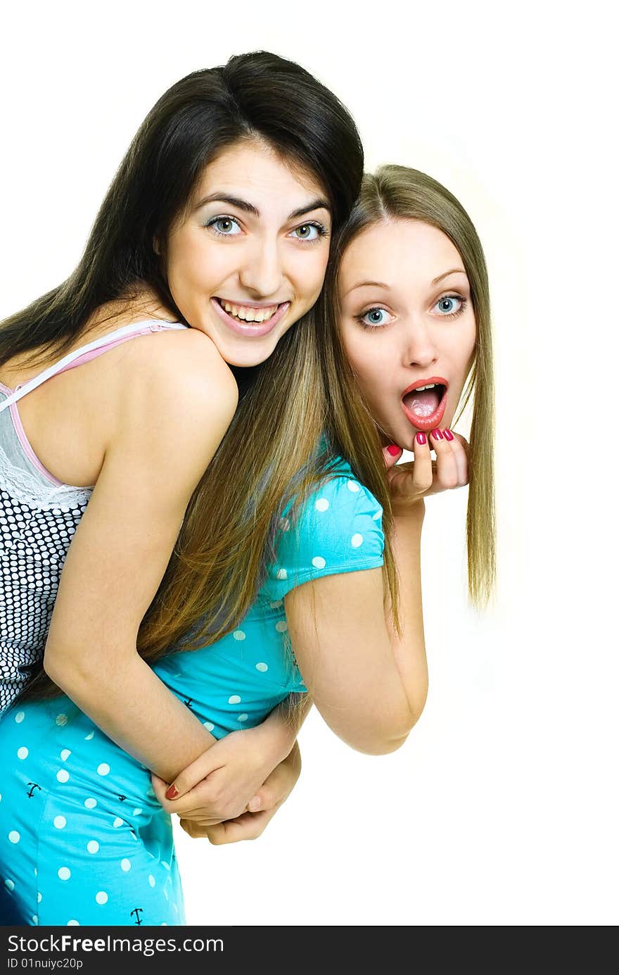 Two young surprised women looking at something. Two young surprised women looking at something