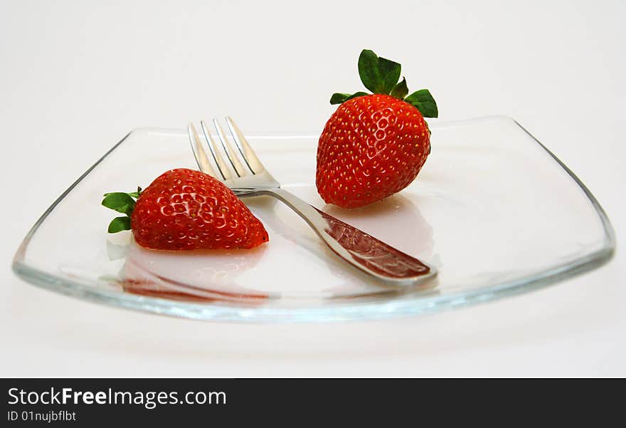 Strawberry on a plate with a plug