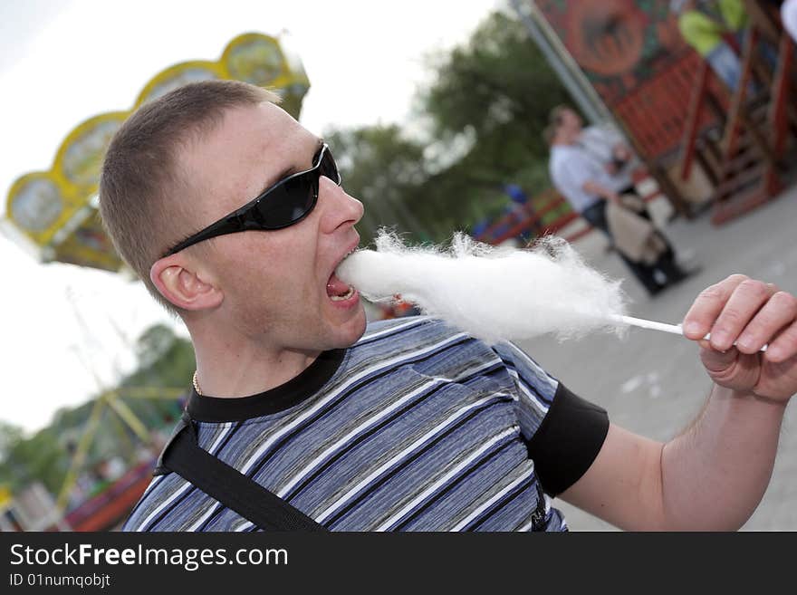 Man eats candy floss