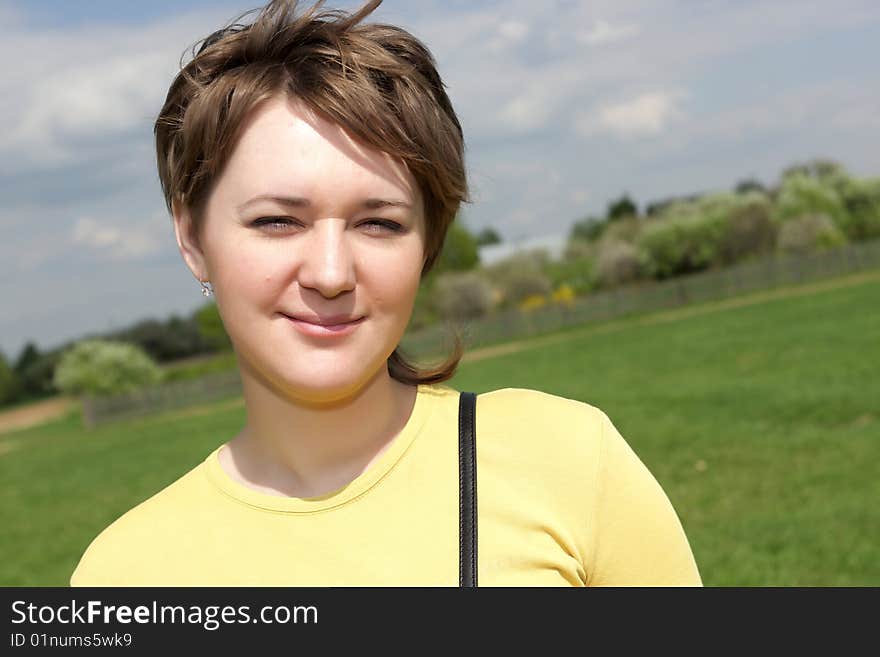 Spring portrait of woman in a park