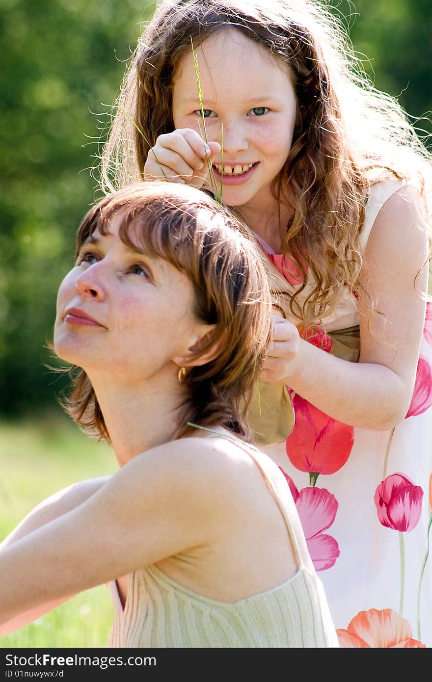 Mother and daughter have a happy time together. Mother and daughter have a happy time together