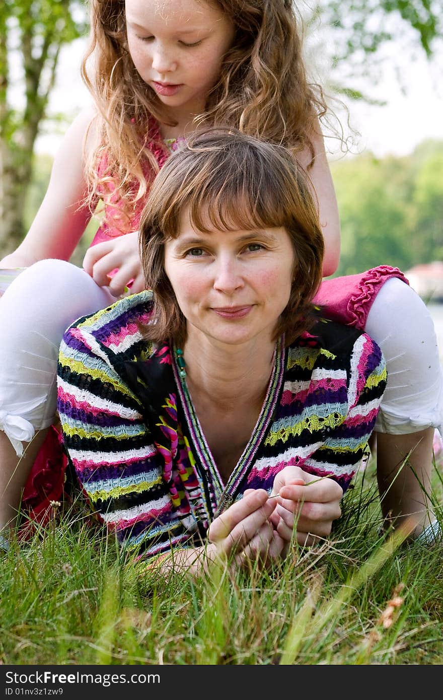 Daugther sitting on mom