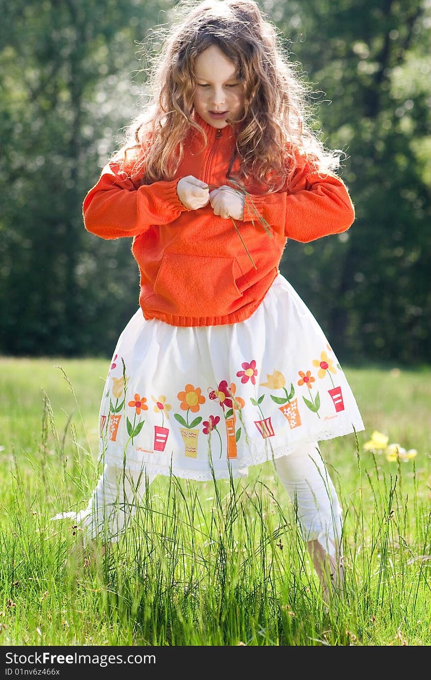 Busy child in the grass