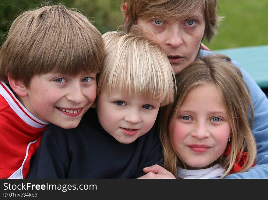 Three kids with mature woman watching me. Three kids with mature woman watching me