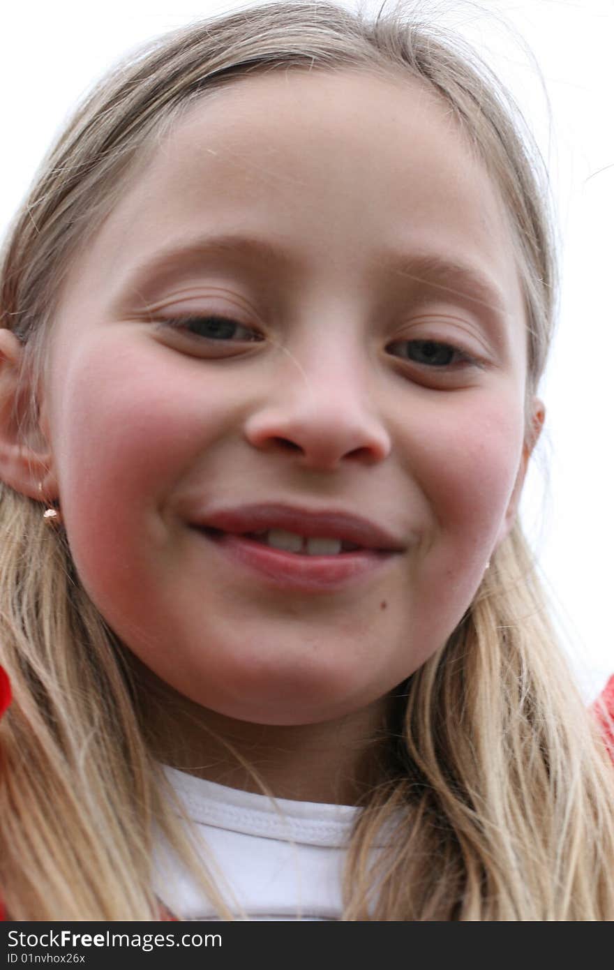 Girl is smiling in the wind, outdoor. Girl is smiling in the wind, outdoor