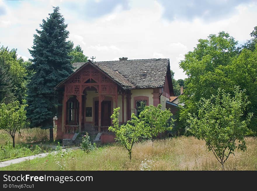 Photo of an old house in trees with broken roof.
nobody lives in it. Photo of an old house in trees with broken roof.
nobody lives in it.