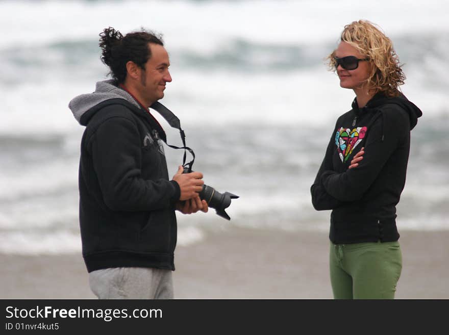 Photographer and his model on the beach. Photographer and his model on the beach