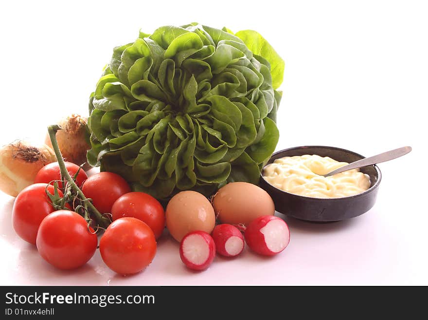 New kind of lettuce with ingredients against a white bakground. New kind of lettuce with ingredients against a white bakground