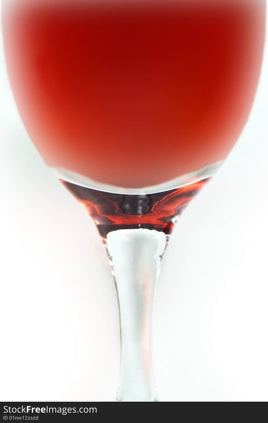 Glass of red wine on white