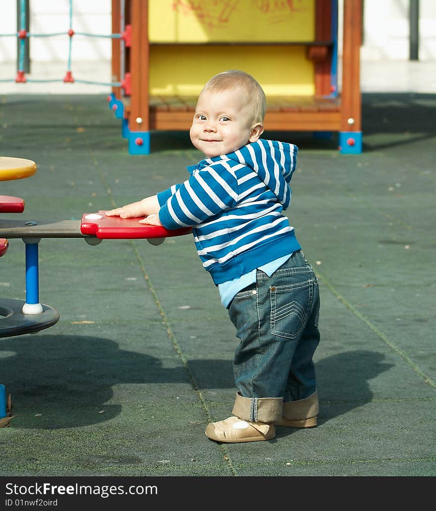 A small child playing in the street. A small child playing in the street