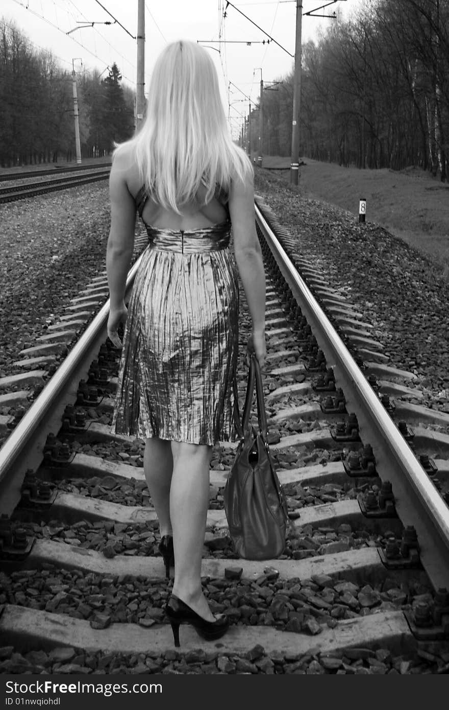 Pretty girl traveling by railroad