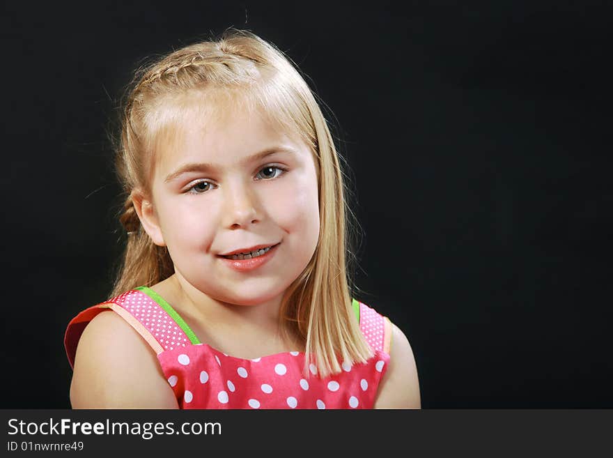 A childs portrait on a black background. A childs portrait on a black background