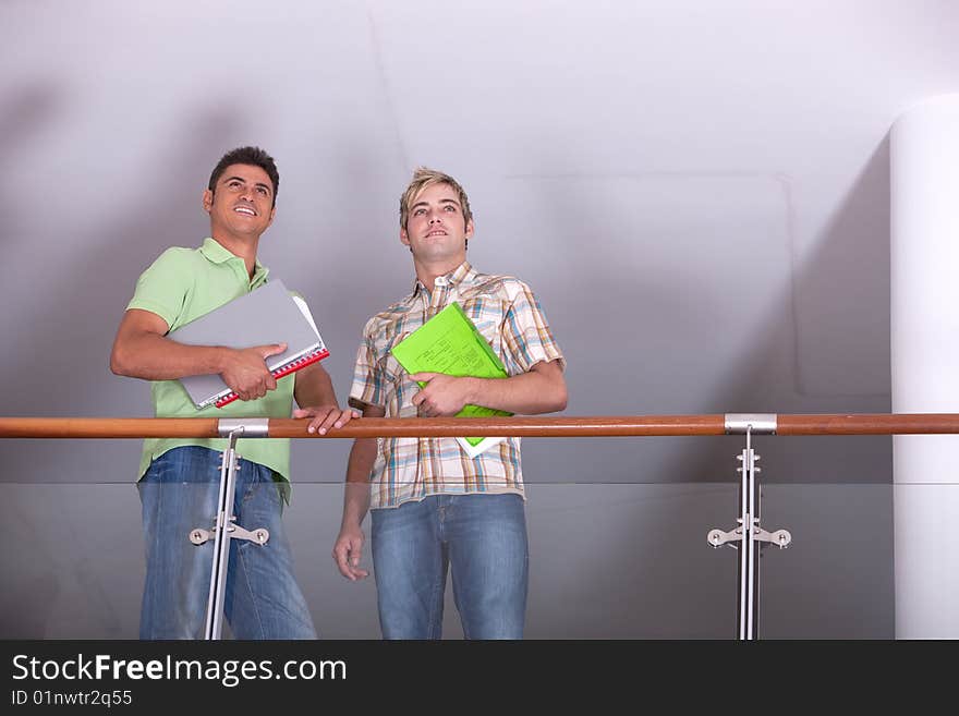 Portrait of study group standing and holding books.