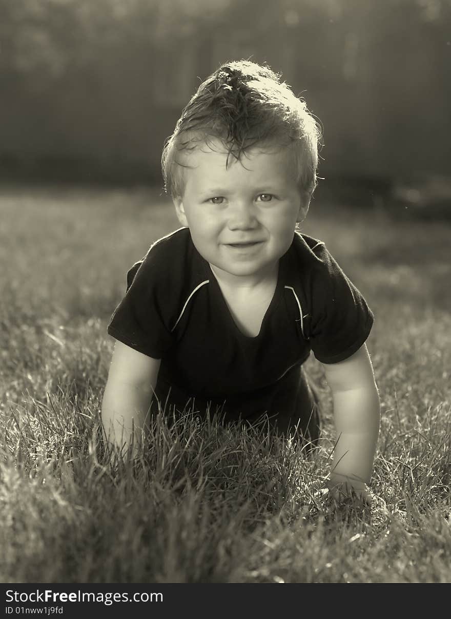 The boy on a grass. The boy on a grass.