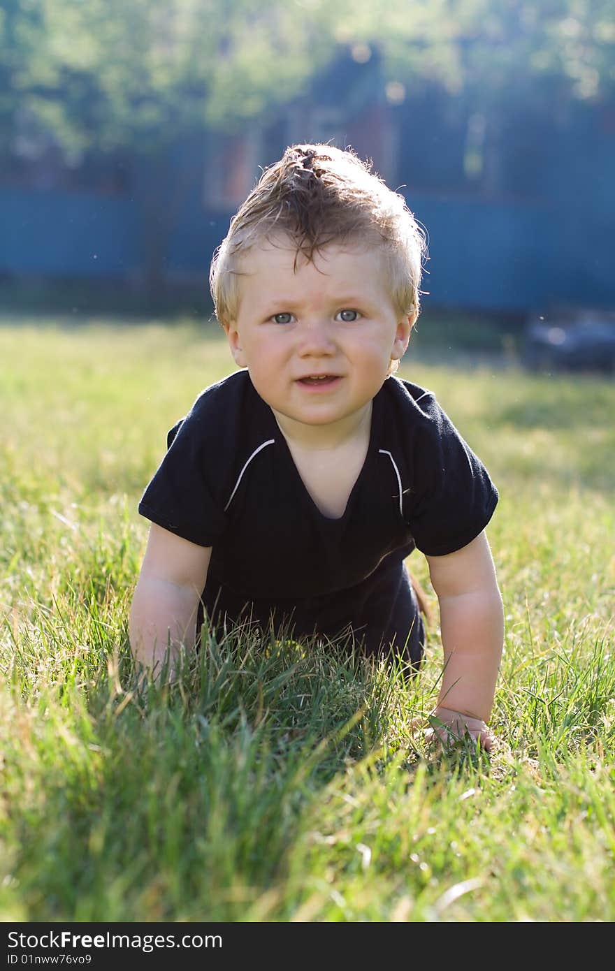 The boy on a grass. The boy on a grass.