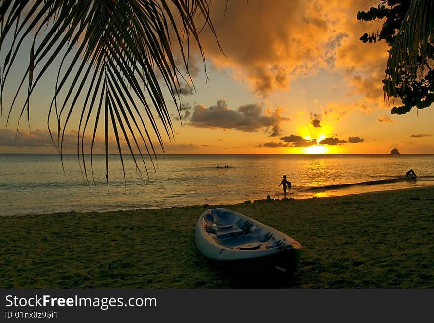 Canoe at sunset,  on a beauiful Caribbean beach