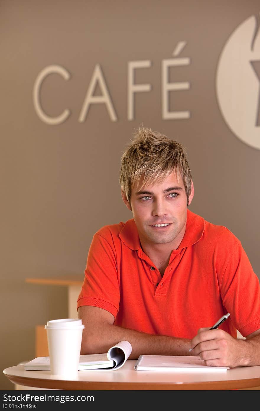 Portrait of male student taking a coffee break.