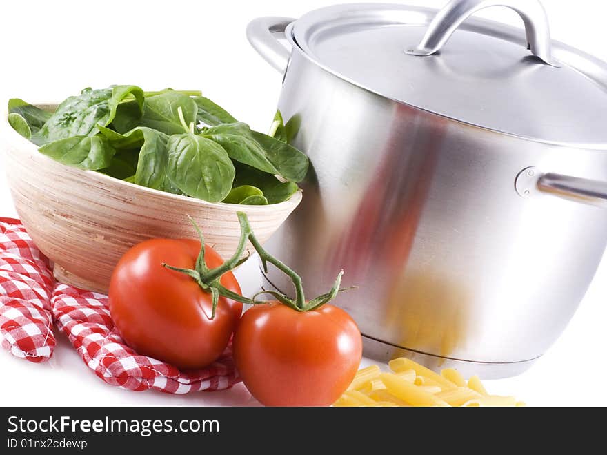 A pan and some ingredients on a white background. A pan and some ingredients on a white background.