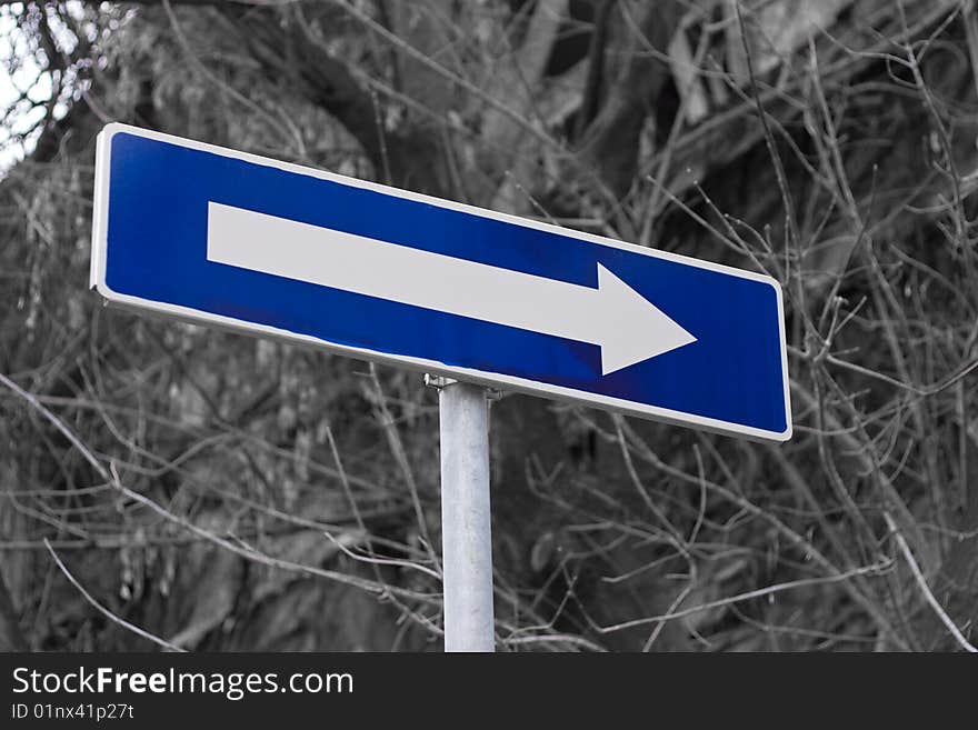 One way traffic sign on street corner