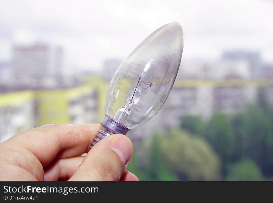 Hand with light bulb