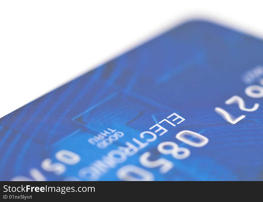 Fragment of a plastic credit card on a white background