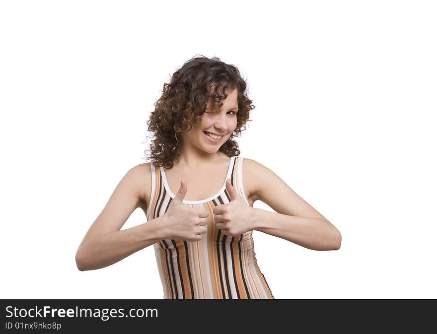 Girl showing thumbs up on white background. Woman looking into the camera while giving an ok gesture with her forward hand. Happiness woman shows OK. Isolated over white background. Girl showing thumbs up on white background. Woman looking into the camera while giving an ok gesture with her forward hand. Happiness woman shows OK. Isolated over white background.