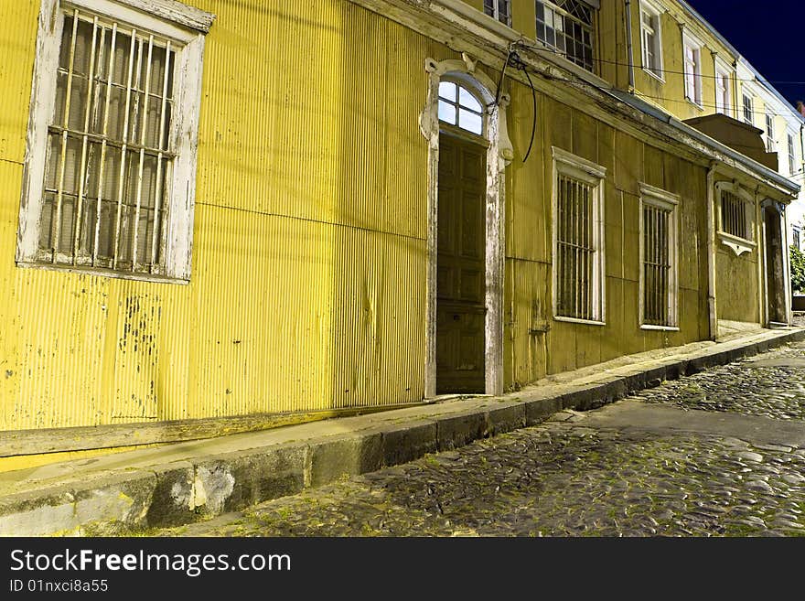 Old house doorsteps looking at a stone street