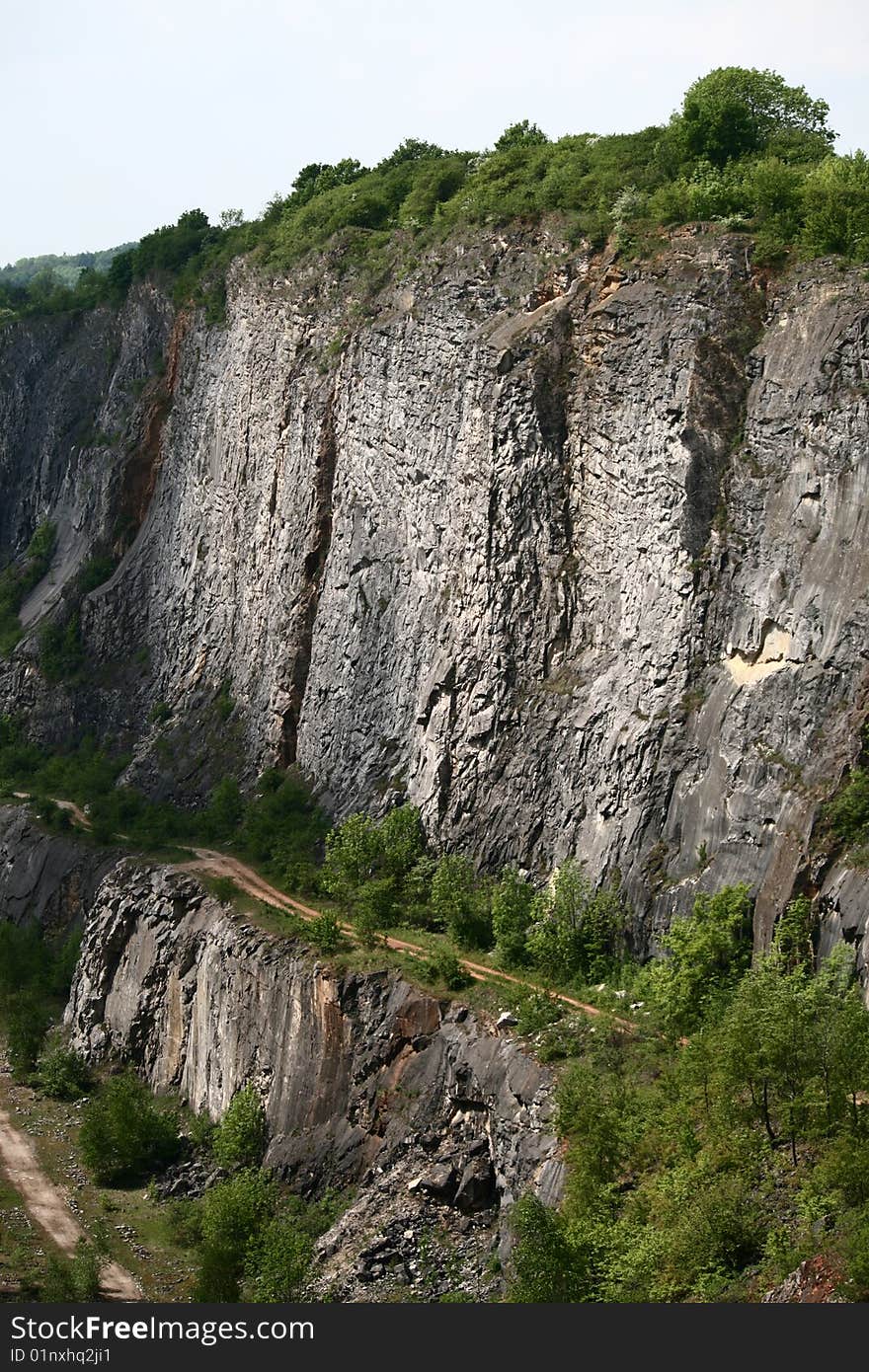 One of the chalky quarries near Morina village and Karlstejn castle in The Czech republic. This region is called Czech Grand Canyon, iit is very popular place for tourists, tramps and filmers. The querry on the picture is called Big America, there is its cliff.