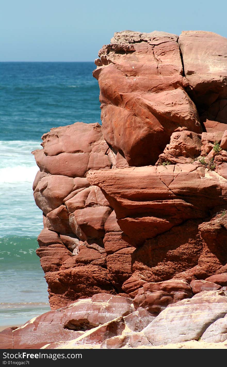 Red rocks on the coast. Red rocks on the coast