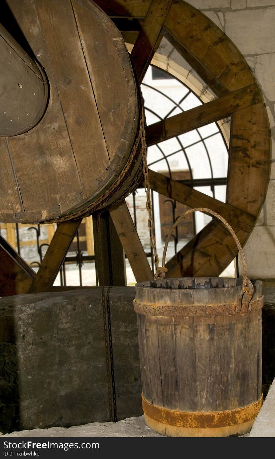 Old wooden and bucket with rusty rings. Old wooden and bucket with rusty rings