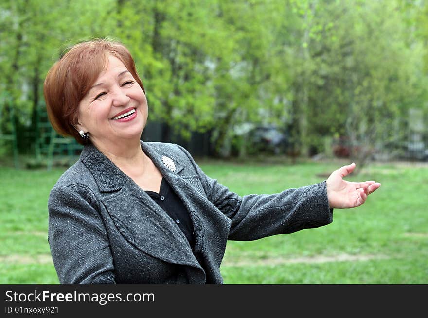 Portrait of a laughing woman in her seventies. Portrait of a laughing woman in her seventies