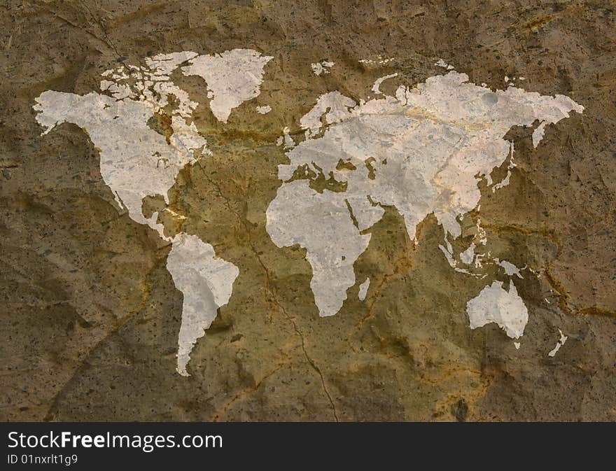 A image of a world map on a textured background like a grunge rock. A image of a world map on a textured background like a grunge rock.