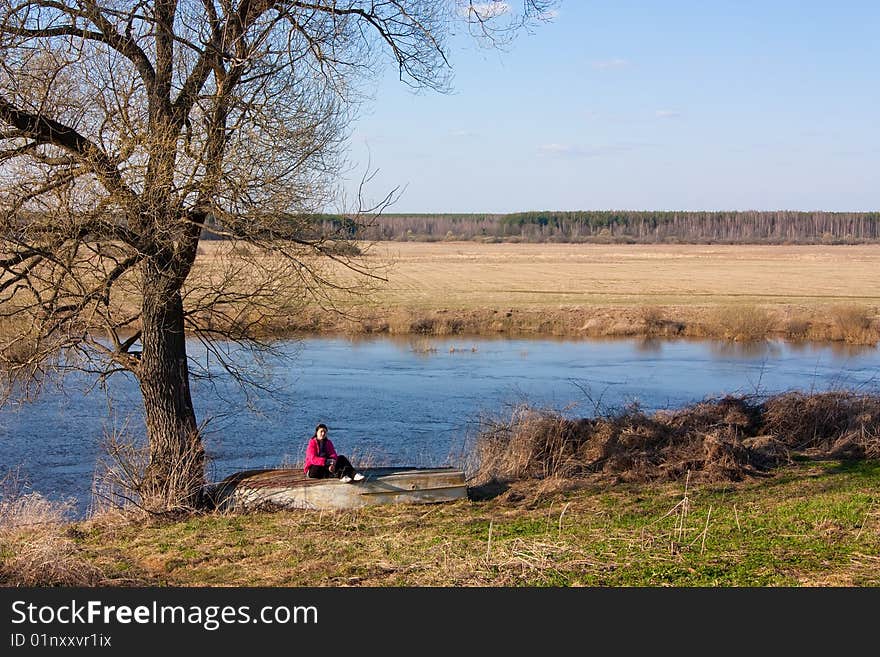 Wooden boat on autumn lake